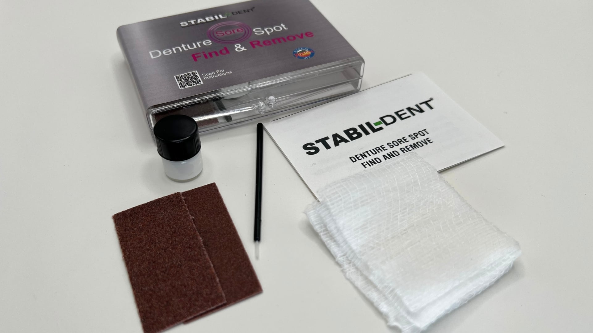 ontents of sore spot find and remove kit. Paste, brush, pads, sand paper and instructions.