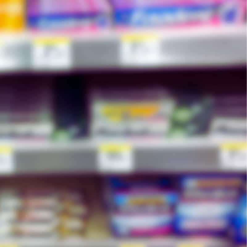 Various brands of denture adhesives on the shelf